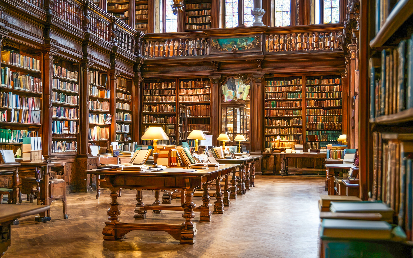 Generic image of a library interior with rows of bookshelves and reading tables, showcasing a quiet study environment.