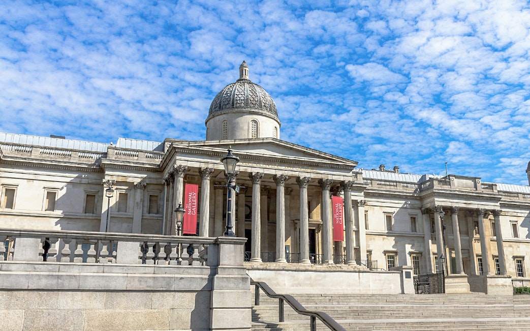 National Gallery in London with classical columns and dome under a blue sky.