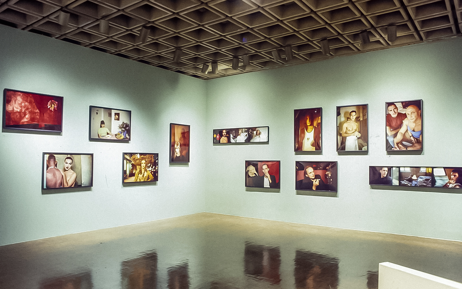 Visitors exploring the 1993 Whitney Biennial exhibition in a spacious art gallery
