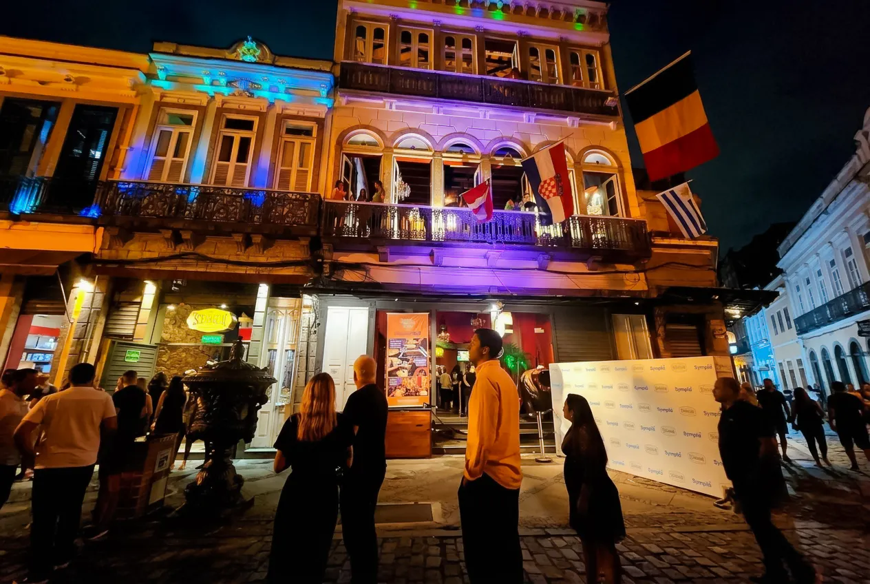 Rio Scenarium facade at night with people gathering outside, Rio de Janeiro.