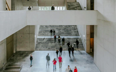Visitors walking through the modern interior of Kunsthaus Zürich museum.
