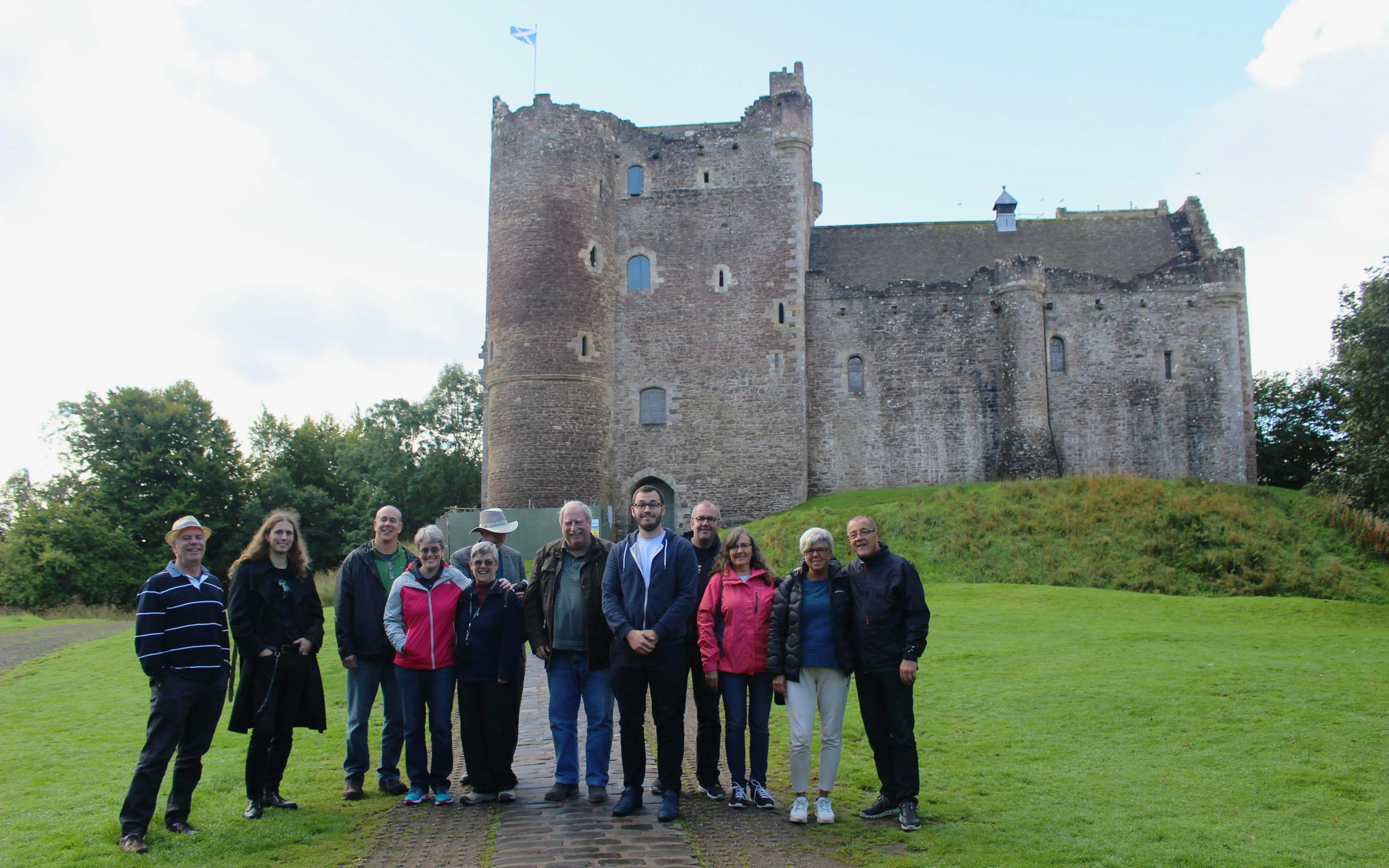 Tour group at Doune Castle, Scotland, during Outlander Experience 1-day tour from Edinburgh.