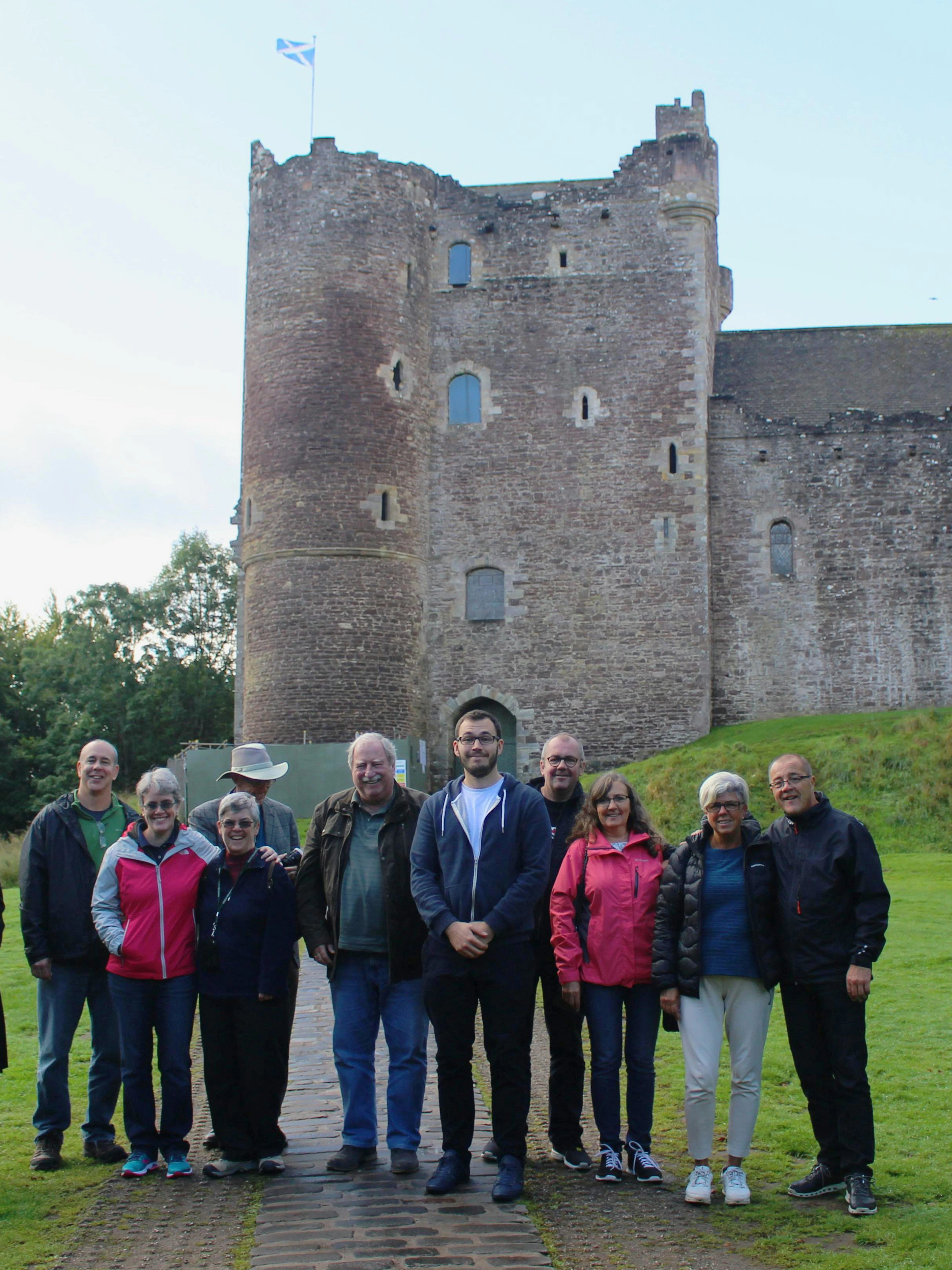 Tour group at Doune Castle, Scotland, during Outlander Experience 1-day tour from Edinburgh.