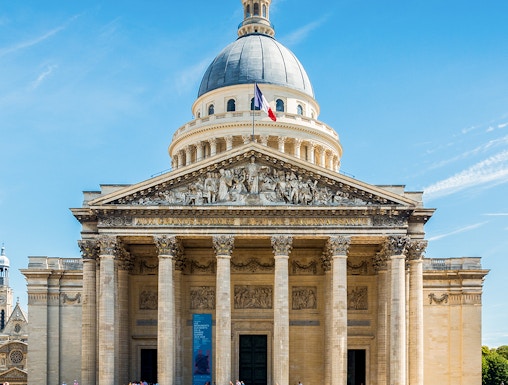 Pantheon in Paris with visitors outside, showcasing neoclassical architecture.