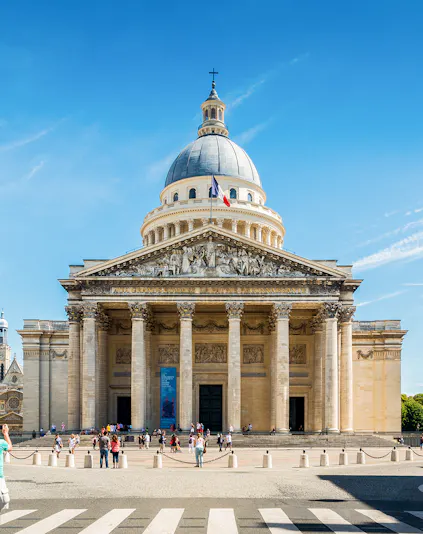 Pantheon in Paris with visitors outside, showcasing neoclassical architecture.