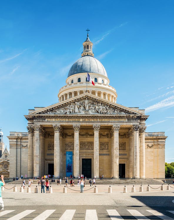Pantheon in Paris with visitors outside, showcasing neoclassical architecture.