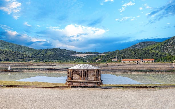 Salt pans with a cart of salt in Ston, Dubrovnik area, Croatia.