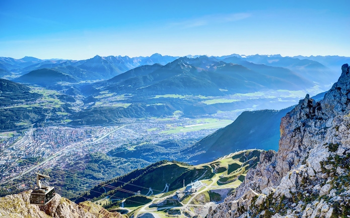 Aerial view from Hafelekarspitze overlooking Innsbruck and surrounding mountains.