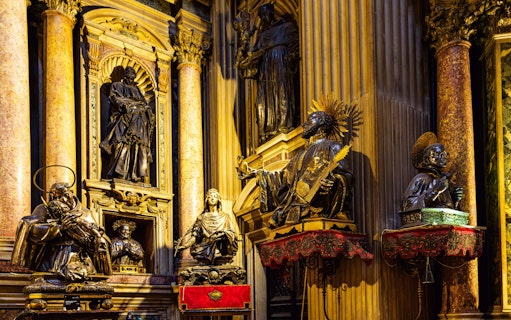 Statues and ornate columns inside the Royal Chapel of the Treasure of San Gennaro, Naples.