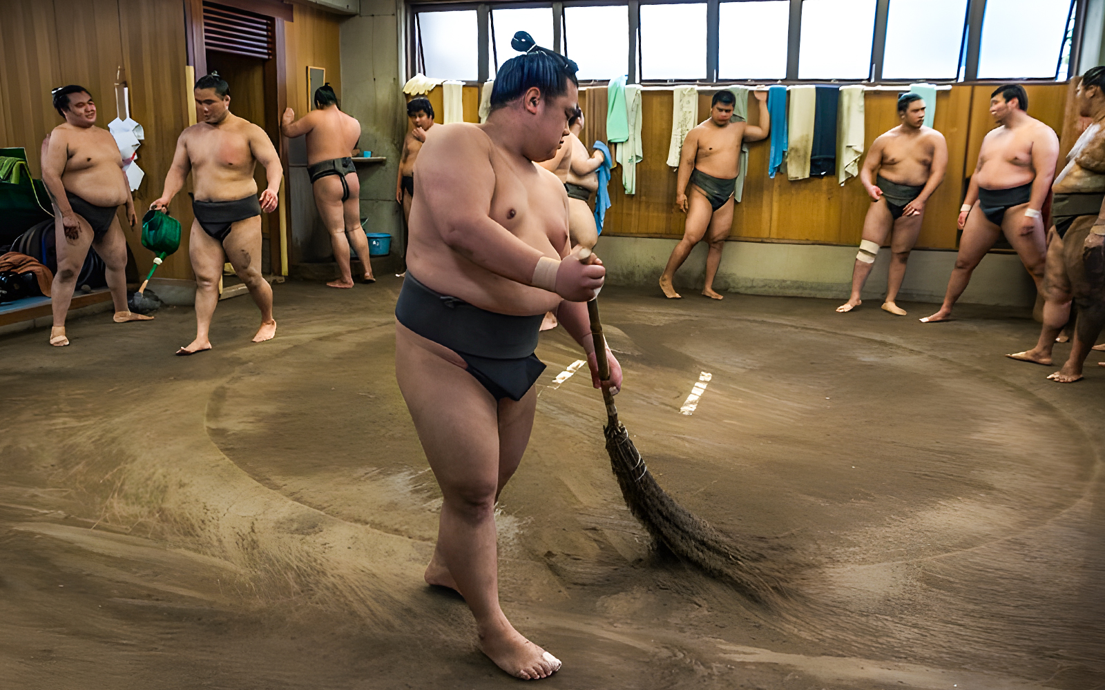 Sumo wrestlers preparing for morning practice at a Tokyo stable.