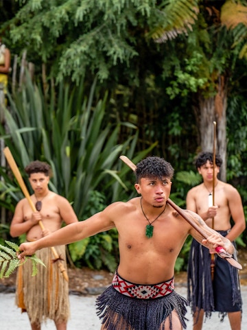 Māori performers in traditional attire at Whakarewarewa, New Zealand.