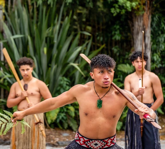 Māori performers in traditional attire at Whakarewarewa, New Zealand.