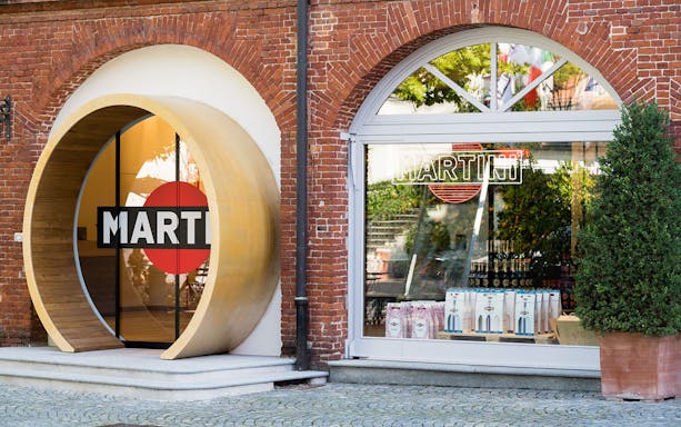 Casa Martini entrance with branded signage and display of products.