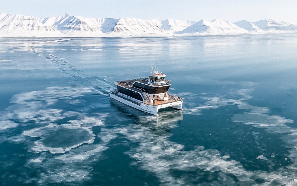 Hybrid electric boat on icy waters during Silent Whale Watching Tour from Tromso.