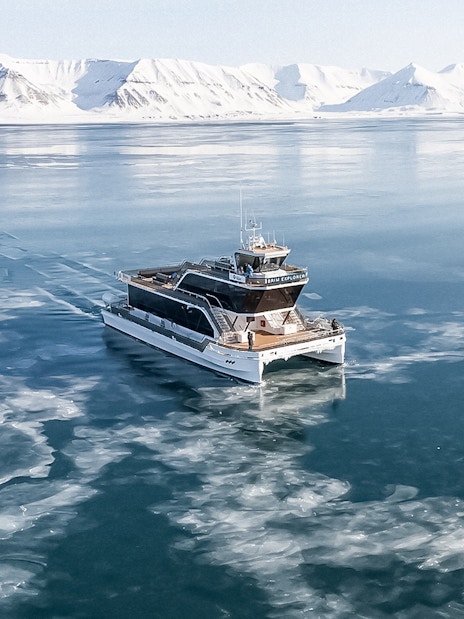 Hybrid electric boat on icy waters during Silent Whale Watching Tour from Tromso.