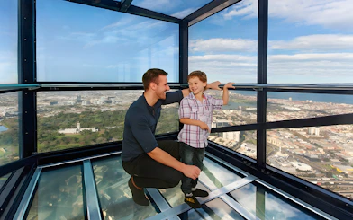 Family enjoying view from Melbourne Skydeck at Eureka Tower.