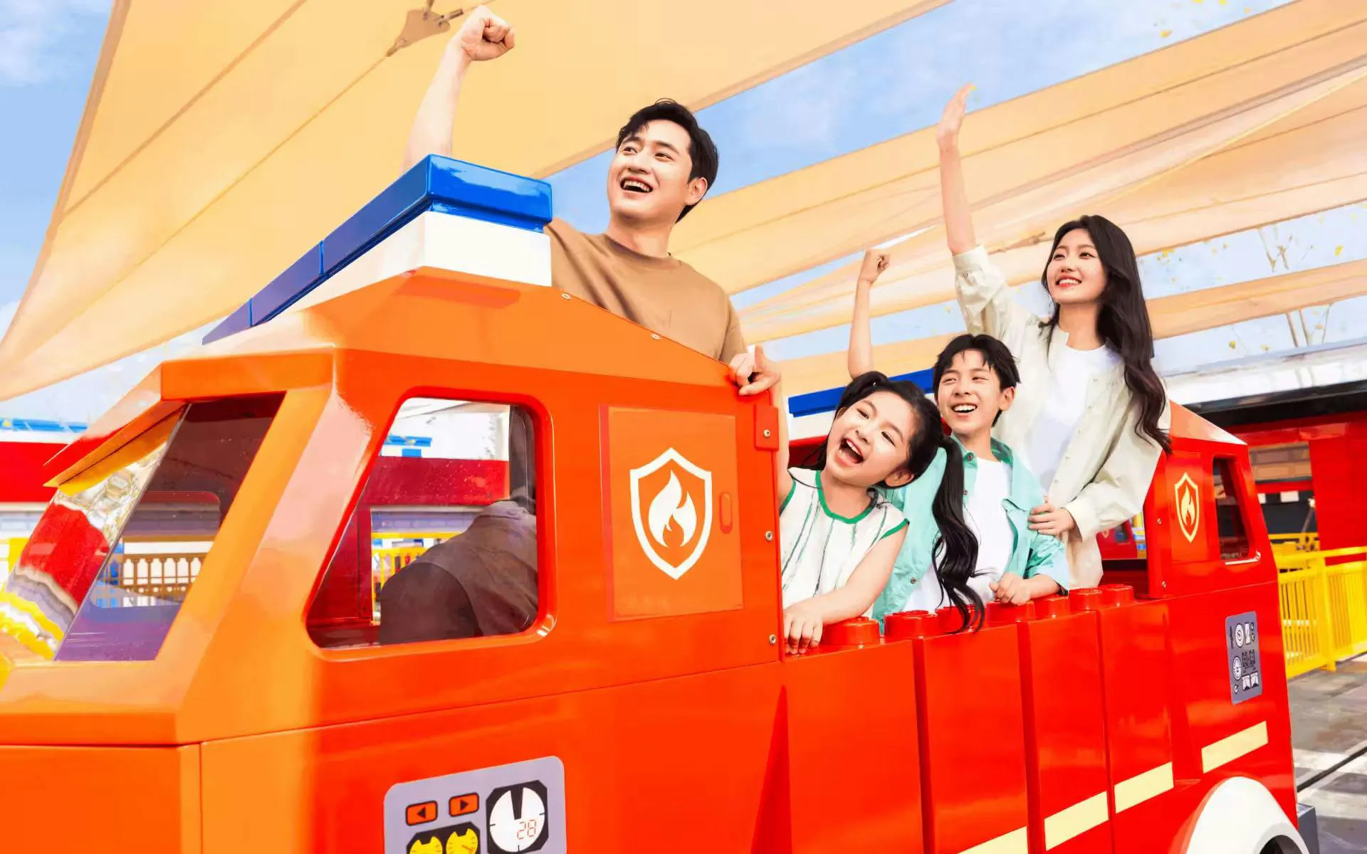 Visitors enjoying the Fire Academy ride at LEGOLAND theme park.