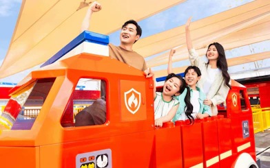 Visitors enjoying the Fire Academy ride at LEGOLAND theme park.