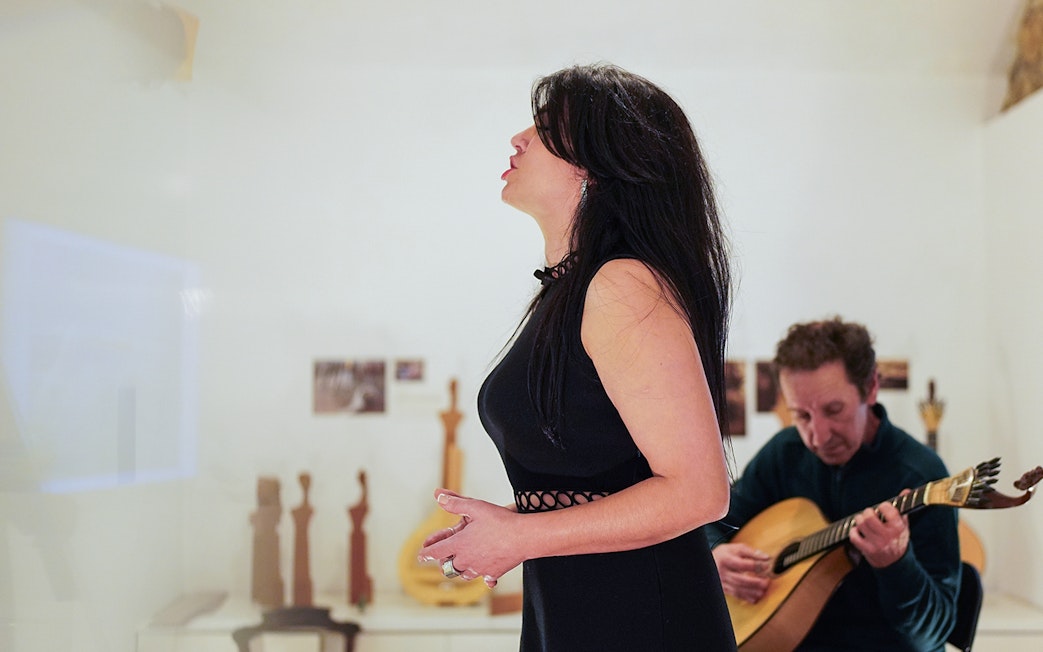 Singer performing with guitarist at Casa da Guitarra, Porto.
