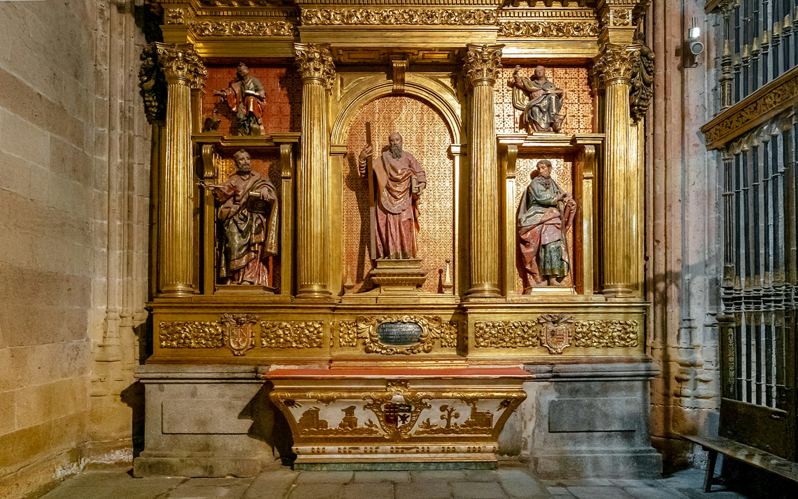 Segovia Cathedral Chapel of San Andrés altar with religious statues and ornate gold detailing.