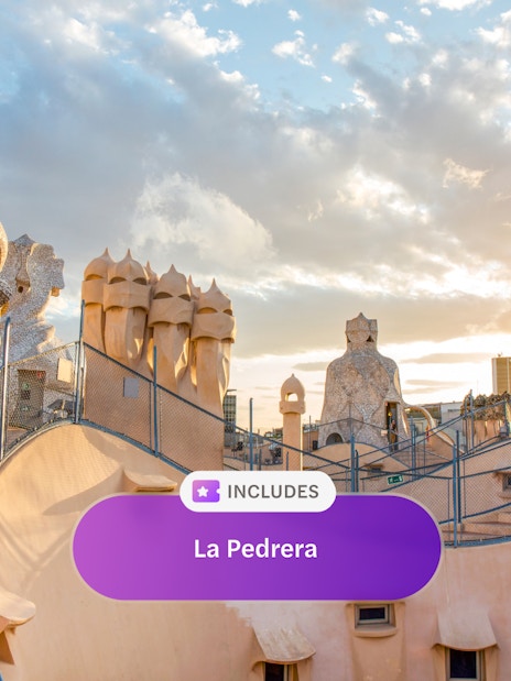 Rooftop chimneys of La Pedrera, Casa Mila in Barcelona at sunset.