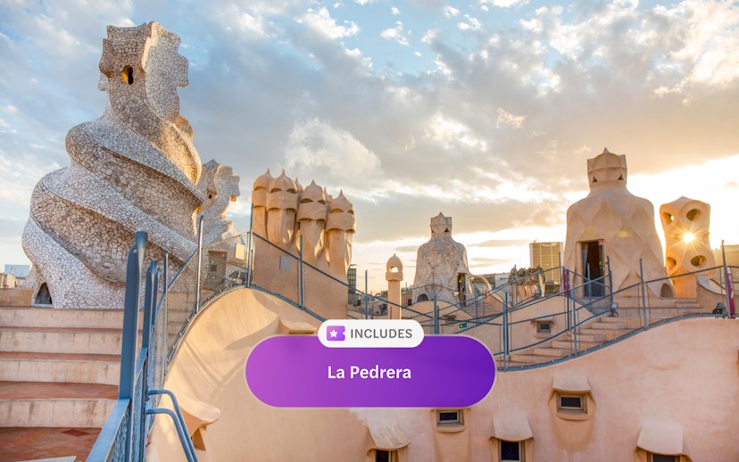 Rooftop chimneys of La Pedrera, Casa Mila in Barcelona at sunset.