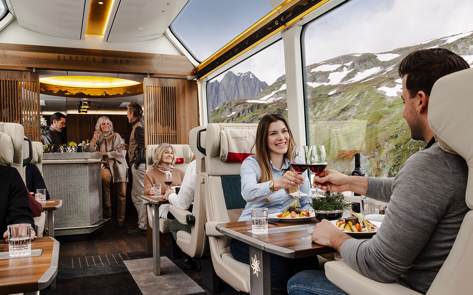 A couple enjoying  a glass of Champagne and a tasty aperitif platter.