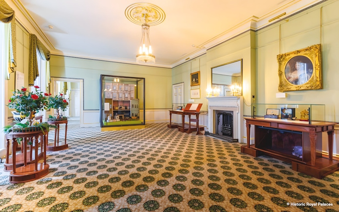 Kensington Palace interior with historical exhibits and elegant decor.