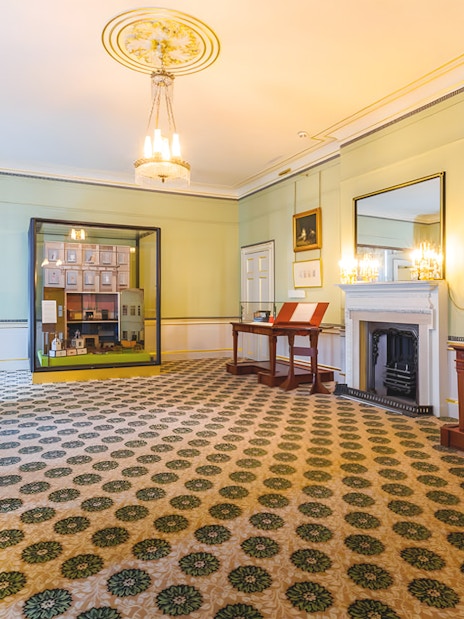 Kensington Palace interior with historical exhibits and elegant decor.