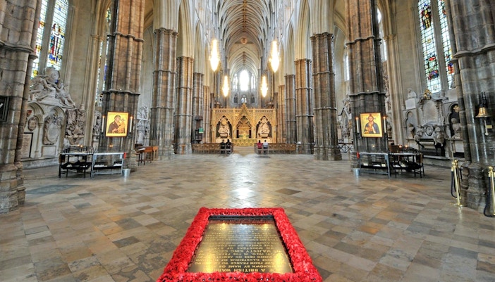 Westminster Abbey interior with memorial and stained glass windows, London.