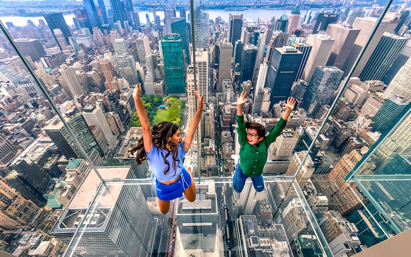 Visitors enjoying the glass observation deck at SUMMIT One Vanderbilt, New York City.