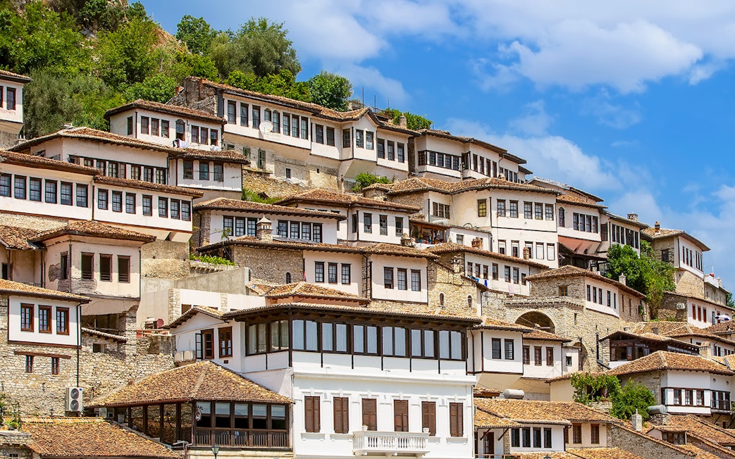Ottoman-style houses on a hillside in Berat, Albania, known as the city of a thousand windows.
