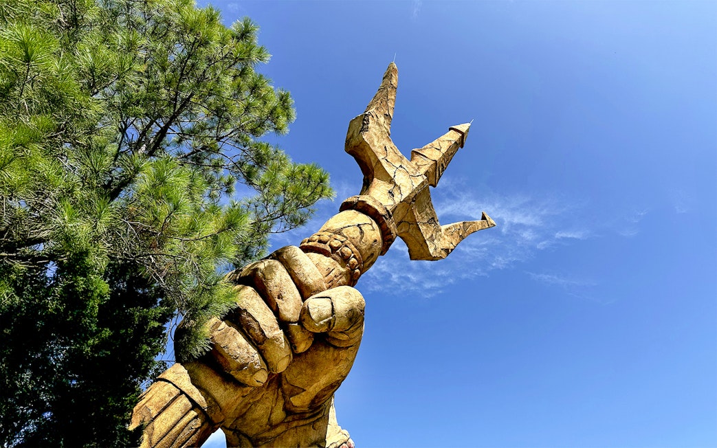 Trident held by a statue's hand at The Lost Continent, Islands of Adventure, Universal Orlando.