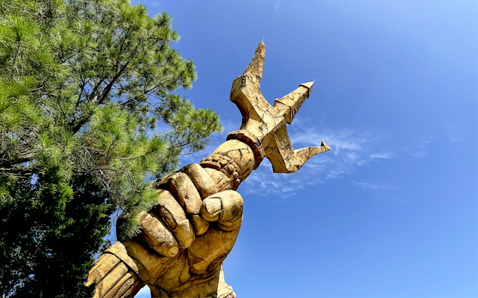 Trident held by a statue's hand at The Lost Continent, Islands of Adventure, Universal Orlando.