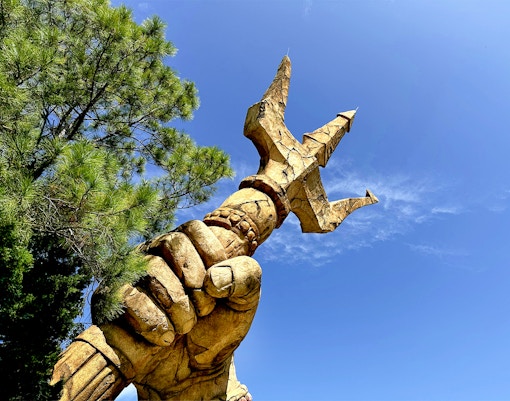 Trident held by a statue's hand at The Lost Continent, Islands of Adventure, Universal Orlando.
