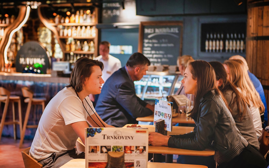 Visitors enjoying a tasting at the Slivovitz Museum bar.