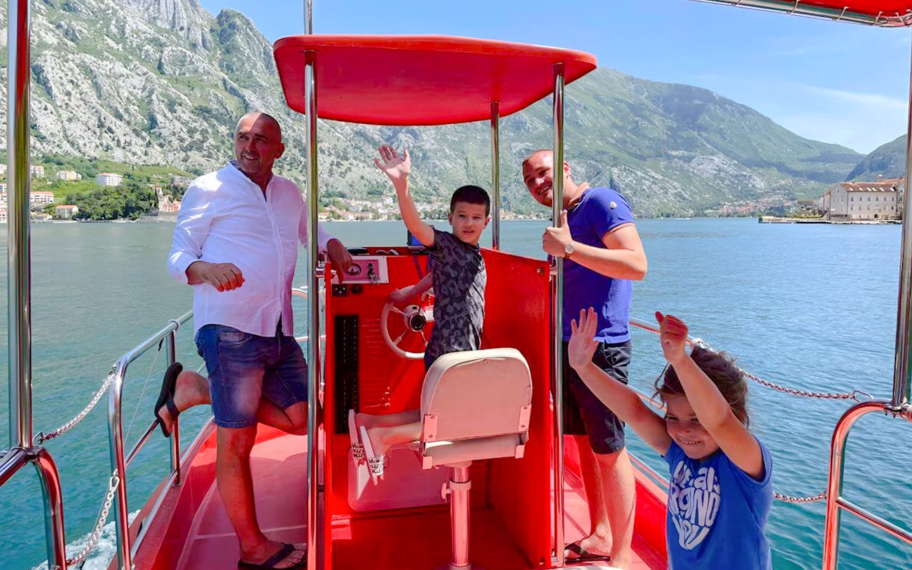 Group of people exploring Boka Bay on a semi-submarine tour, Kotor, Montenegro.