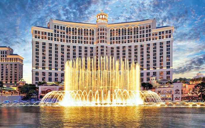 Bellagio Hotel and Fountains in Las Vegas at dusk.