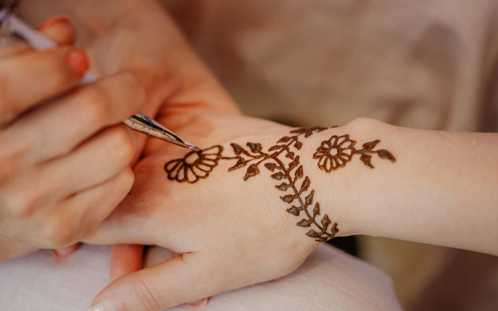 Henna tattoo being applied at Bedouin Desert Camp by Atlanta Tourism.