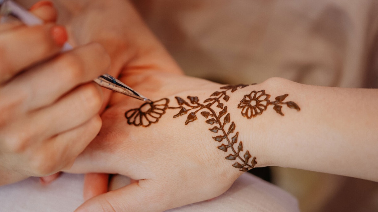 Henna tattoo being applied at Bedouin Desert Camp by Atlanta Tourism.