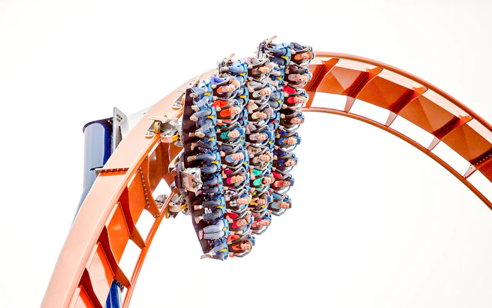 Riders on Valravn roller coaster at Cedar Point during a steep drop.