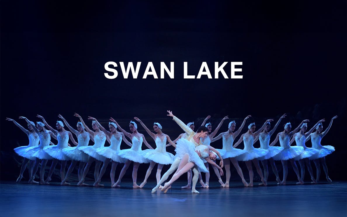 Ballet dancers performing Swan Lake on stage.