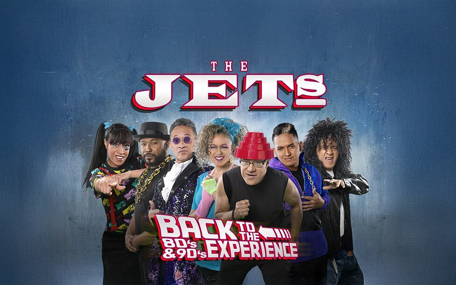 The Jets band members in 80's and 90's themed attire for Back to the 80's & 90's Experience.