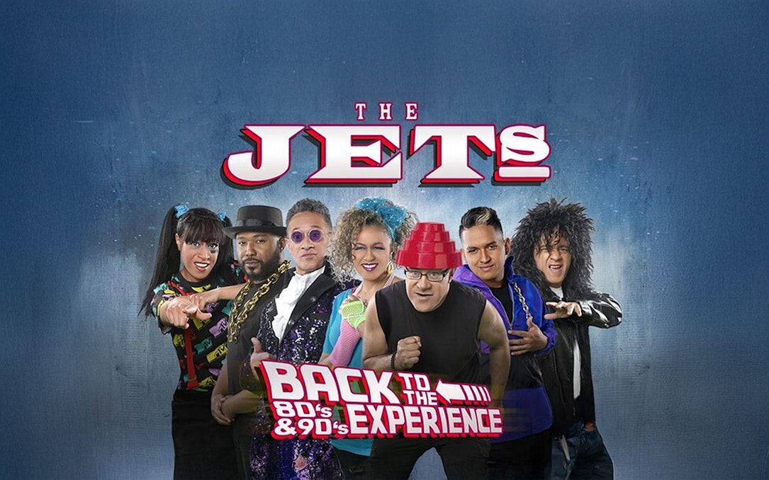 The Jets band members in 80's and 90's themed attire for Back to the 80's & 90's Experience.