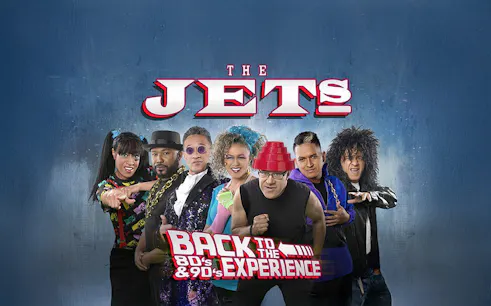 The Jets band members in 80's and 90's themed attire for Back to the 80's & 90's Experience.