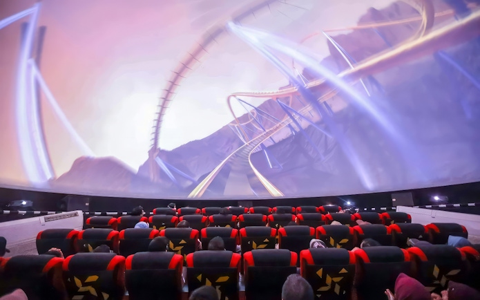 Visitors watching a roller coaster simulation at SkyDome, Langkawi.