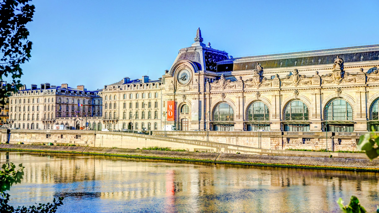 Orsay Museum facade along the Seine River in Paris.