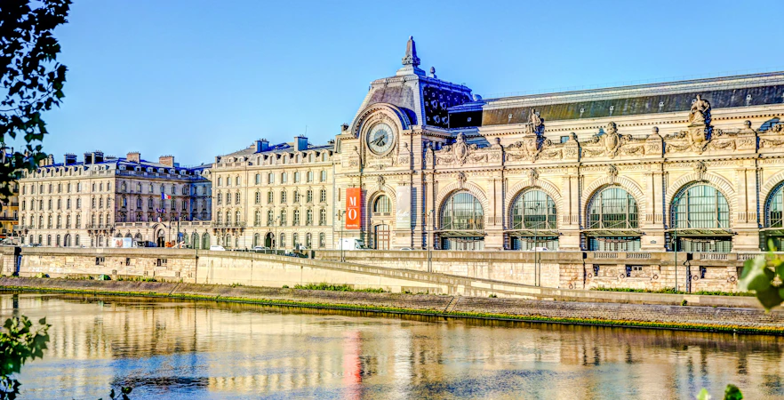 Orsay Museum facade along the Seine River in Paris.