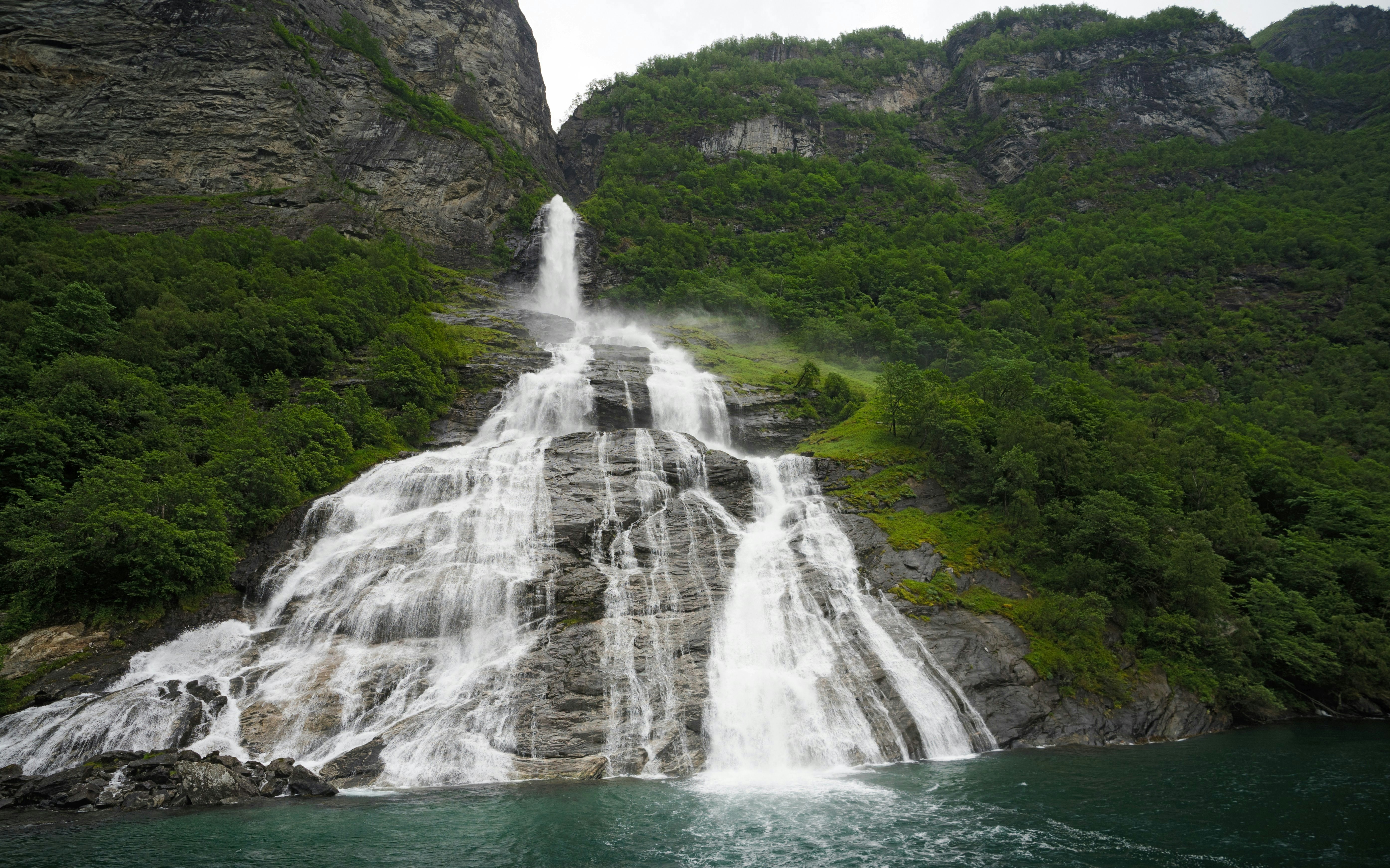 Bridal Veil Waterfall cascading down rocky cliffs in Geiranger, Norway.