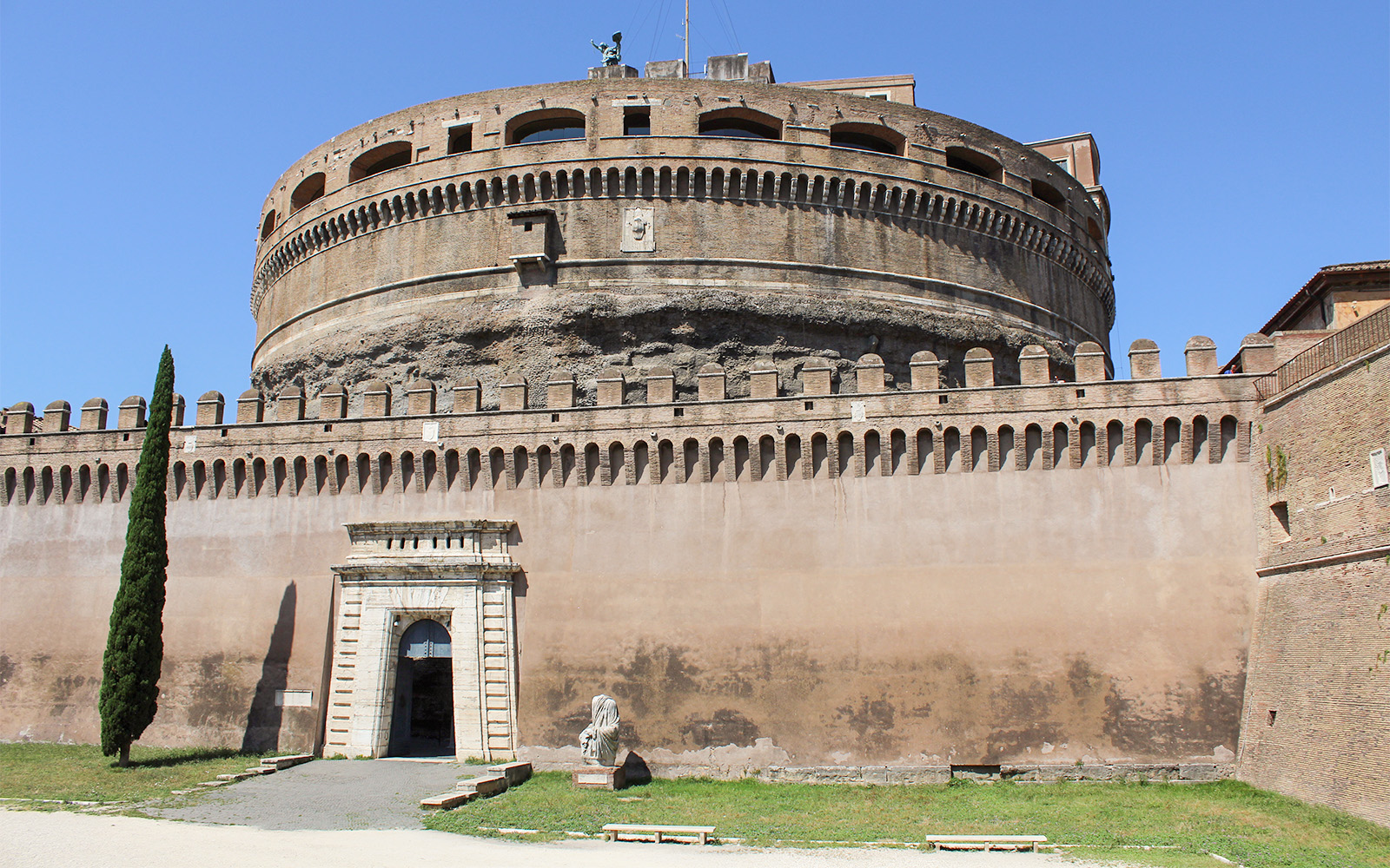 Castel Sant'Angelo exterior with entrance and statue, Rome, Italy.